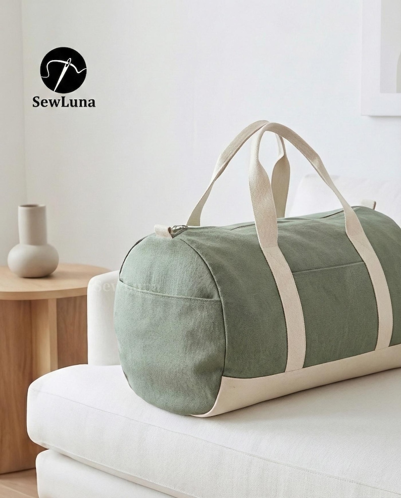 Minimalist earthy green and beige canvas duffle bag sewing pattern PDF with sturdy webbing handles and a side pocket, displayed against a light grey background. Perfect weekender bag sewing project.