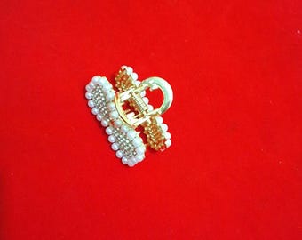 Garra de cabello dorado
