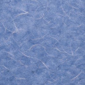 May include: Close-up of textured, light blue paper with white, thread-like fibres scattered across the surface. The paper has a soft, fibrous appearance, with the white fibres creating a delicate, organic pattern.