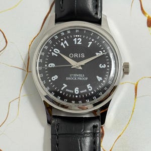 Zabytkowy męski zegarek na rękę Oris Tachymeter z czarną tarczą i naciągiem ręcznym FHF, ST-96, szwajcarski
