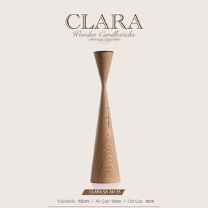 May include: A tall, light-brown wooden candlestick with a flared top and a wide, conical base. The text CLARA Wooden Candlesticks appears above the object. Below, the text CLARA ŞA 24125, Yükseklik: 55cm, Alt Çap: 13cm, and Üst Çap: 8cm is visible.