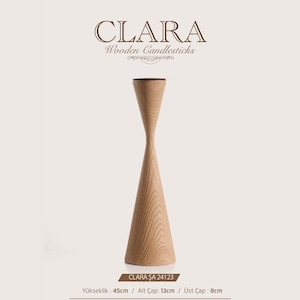 May include: A light brown wooden candlestick with a tapered hourglass shape. The text CLARA Wooden Candlesticks is at the top. Below the object, the text CLARA ŞA 24123 is visible, along with dimensions: height 45 cm, base diameter 13 cm, top diameter 8 cm.