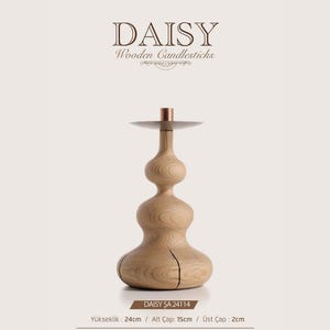 May include: A light-colored wooden candlestick with a stacked, bulbous shape and a flat metal top plate. The text DAISY Wooden Candlesticks is visible above. Dimensions are 24 cm in height, 15 cm base diameter, and 2 cm top diameter.
