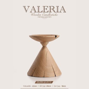 May include: A light-colored wooden candlestick with a conical base and a wide, shallow top. The object features visible wood grain and natural cracks. Text on the image includes VALERIA Wooden Candlesticks, VALERIA ŞA 24115, and dimensions: height 22cm, base diameter 20cm, top diameter 18cm.