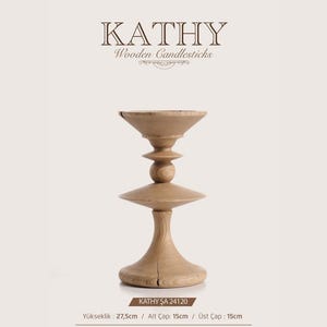 May include: A light brown wooden candlestick with a flared top, a central sphere, and a wide circular base. The text KATHY Wooden Candlesticks is at the top. Dimensions are 27.5 cm in height, with a 15 cm base and top diameter.