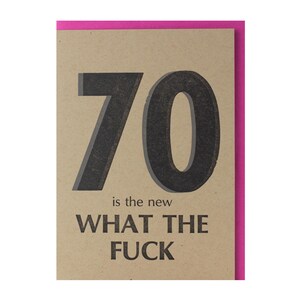 May include: A greeting card with a pink border and a tan background. The card features the number "70" in large, dark gray letters, with the phrase "is the new WHAT THE FUCK" printed below in a similar font.