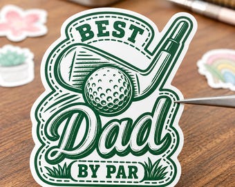 May include: A die-cut sticker featuring a dark green and white graphic of a golf club and ball. The text reads BEST DAD BY PAR in a stylized font. The design includes a dashed border and small grass illustrations at the bottom of the sticker.