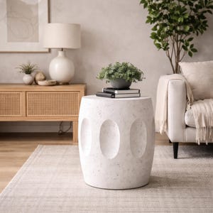 May include: A set of three ceramic mugs with a speckled, matte finish. The mugs are in shades of cream, light gray, and dark gray. Each mug has a simple, minimalist design and a rounded handle.