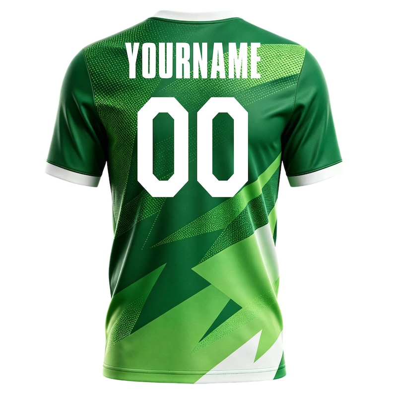 May include: Green and white athletic jersey with the text "YOURNAME" above the number "00". The jersey has a white collar and sleeve cuffs. The design features a geometric pattern in shades of green.