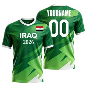 May include: Green and white soccer jersey with the word "IRAQ" and the number "2026" printed on the front. The jersey also features the Iraqi flag and the number "00" on the back. The text "YOURNAME" is printed above the number.