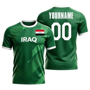May include: Green soccer jersey with white accents, featuring the word "IRAQ" and the Iraqi flag on the front. The back displays the word "YOURNAME" and the number "00" in white. The jersey has a geometric design.