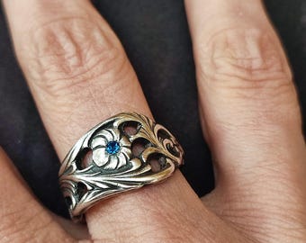 Silver-plated metal ring inlaid with a royal blue crystal, made from an antique Dutch fork