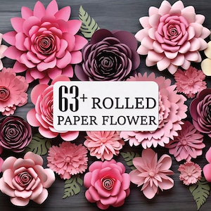 May include: A collection of over 63 rolled paper flowers in various shades of pink, rose, and burgundy, with green paper leaves. The flowers are arranged on a dark gray surface. A white sign reads "63+ ROLLED PAPER FLOWER."