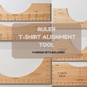 May include: Wooden T-shirt alignment tool with inch measurements for infant and adult sizes, plus V-neck options. The text "RULER T-SHIRT ALIGNMENT TOOL" is displayed. Includes 4 unique sets.