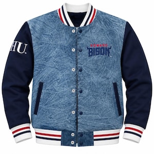 May include: A varsity jacket featuring a blue acid-wash denim body and solid navy blue sleeves. The chest displays the text HOWARD BISON in blue and red, while the right sleeve features the letters HU. It has a snap-button front and striped trim.