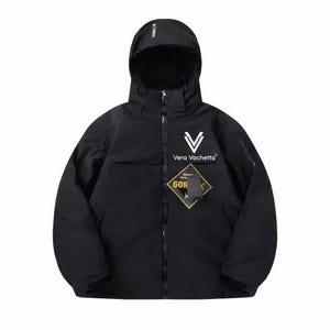 May include: Black hooded jacket with the text "Vera Vachetta" in white. The jacket has a zip closure and a "Gore-Tex" label. The jacket is a solid black colour.