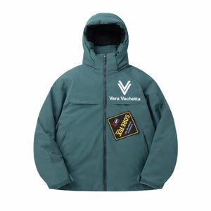 May include: A teal hooded jacket with a full-length zip and a black interior. The jacket features the white text "Vera Vachetta" and a "GORE-TEX" patch. The jacket has a relaxed fit and is designed for outdoor wear.