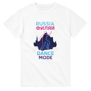 May include: White t-shirt featuring the words "RUSSIA ФИЛЯЙ" in blue and pink, and "DANCE MODE" in blue. A neon-style dancer graphic is in the center. The shirt is made of a soft, comfortable material.