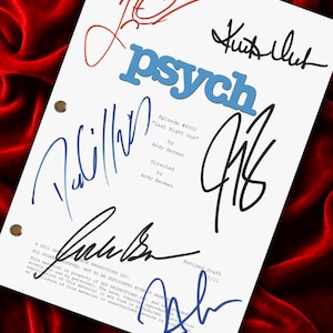 May include: A white television script titled Psych, Episode 6002, Last Night Gus, by Andy Berman. The document features three metal binder holes on the left side and contains multiple handwritten signatures in black, blue, and red ink across the page.