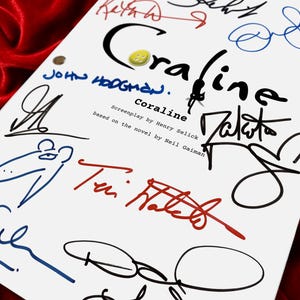 May include: A white script with the title "Coraline" and multiple signatures in various colors. The title is in black with a yellow button in the center. The screenplay is based on the novel by Neil Gaiman.