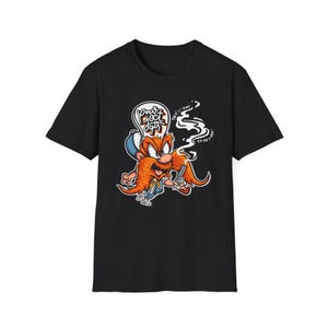 May include: Black t-shirt featuring a cartoon character with a large orange mustache and a gun. The character is smoking and has a speech bubble that says "Don't eject, guy". The shirt has the words "They're out to get you!" in white.