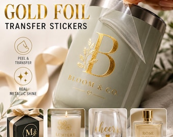 May include: Custom gold foil transfer stickers applied to a sage green container. The design features a large letter B with a leaf motif and the text BLOOM & CO. Additional examples show the stickers on gift boxes, candles, glassware, and perfume bottles.