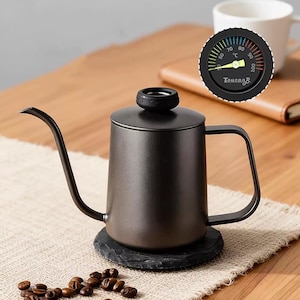 May include: A set of three ceramic mugs with a speckled, matte finish in cream, light grey, and dark grey. Each mug has a minimalist design and a rounded handle.