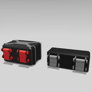 May include: Two black rectangular containers with red and gray accents. The larger container has red rollers on the sides. The smaller container has gray rollers. Both containers are on a light gray background.