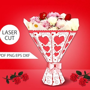 May include: A paper bouquet holder with a red heart design, filled with a variety of flowers. The holder is tied with a pink ribbon. The words "LASER CUT" and "SVG PDF PNG EPS DXF" are also visible.