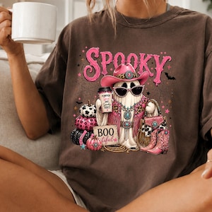 Two-color glam ghost PNG bundle showing turquoise and pink western Halloween designs for sublimation, DTF printing, and small-business physical products.