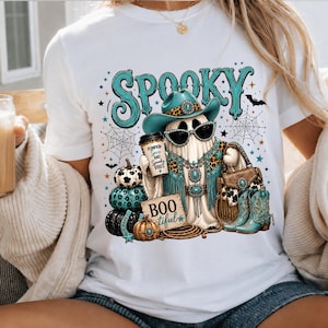 Spooky cowgirl sublimation design for Halloween shirts, sweatshirts, tote bags, tumblers, and boutique apparel featuring a glamorous western ghost and leopard accents.