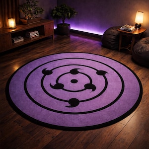 May include: A round purple rug with a black border and a black design in the center. The design features concentric circles with curved shapes. The rug is on a hardwood floor in a room with ambient lighting.