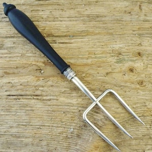 Antique bread fork silver plate ebony