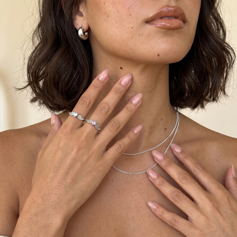 Romantic angel wing ring in solid S925 silver with a pink heart crystal or clear crystal heart at the center, a delicate cz ring and dainty silver promise ring for her, perfect as a cute gift for girlfriend, wife, best friend, daughter or any loved one.