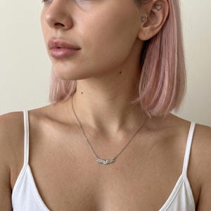 S925 sterling silver pendant necklace with elegant angel wings, an everyday necklace polished to a mirror finish. A meaningful necklace for her that doubles as a faith necklace, memorial keepsake, or layered necklace accent. Premium rhodium plating preserves the bright silver shine and resists tarnish.