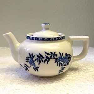 May include: A rustic wooden sign with the text "Welcome to our home" in white lettering. The sign features a distressed finish and a simple, inviting design, perfect for front door decor.