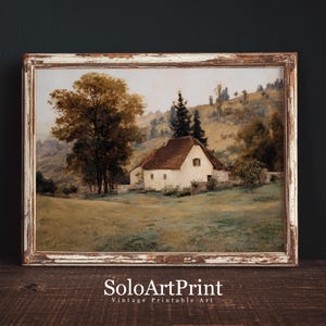 May include: A landscape painting in a distressed brown wooden frame depicting a white cottage with a brown roof nestled in a grassy field. A large tree stands to the left, with rolling hills and evergreen trees in the background. Text reads SoloArtPrint.