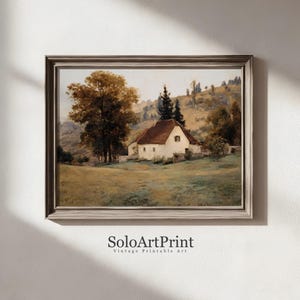 May include: A framed landscape painting featuring a white cottage with a brown roof nestled in a grassy field, surrounded by large trees and rolling hills under a soft sky. The text SoloArtPrint Vintage Printable Art is printed below.