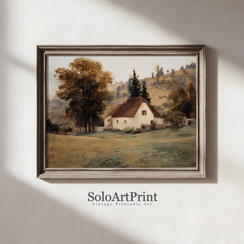 May include: A framed landscape painting featuring a white cottage with a brown roof nestled in a grassy field, surrounded by large trees and rolling hills under a soft sky. The text SoloArtPrint Vintage Printable Art is printed below.