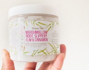 Puede incluir: Un tarro de plástico blanco con una etiqueta verde y blanca que dice "Protein Free Marshmallow Root, Slippery Elm & Cinnamon Deep Conditioning Treatment Extra-Moisturizing, Natural Herbs for all hair types 16Fl oz".
