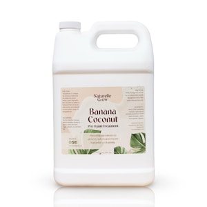 May include: A white plastic container of hair treatment with a handle. The label reads "Naturelle Grow Banana Coconut Pre-Wash Treatment." The label also includes text about the product's ingredients and benefits. The container holds 33.8 fl oz (1 liter).