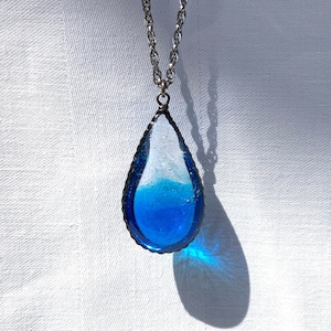 glass raindrop pendant . clear / blue . glass jewelry . stainless steel
