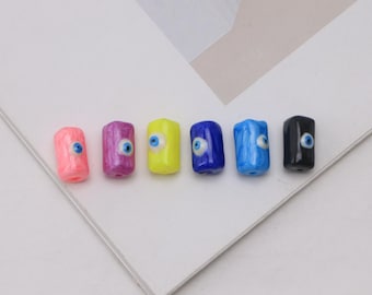 Conjunto de 5 contas cilíndricas de cristal com o olho grego, em formato de tubo, com cores sortidas, ideais para confecção de bijuterias.