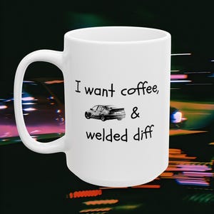 May include: A set of three ceramic mugs with a speckled, matte finish. The mugs are in shades of cream, light gray, and dark gray. Each mug has a simple, minimalist design and a rounded handle.