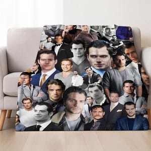 May include: A plush blanket featuring a collage of images of a celebrity. The images are in various sizes and poses, with a mix of color and black and white photos. The blanket is draped over a light-colored sofa.