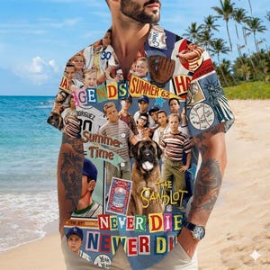 May include: A short-sleeved button-down shirt featuring a collage of images and text from the movie "The Sandlot." The design includes baseball imagery, a dog, and the phrases "Summer Time," "Never Die," and "The Sandlot."