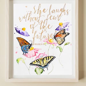 May include: A watercolour painting of butterflies and flowers with the quote "She laughs without fear of the future" and the scripture "Proverbs 31:25" in gold lettering.