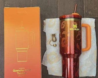 The Stanley 1913 x KAROL G 40 oz Quencher H2.O FlowState Tumbler