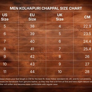 May include: A men's Kolhapuri chappal size chart showing US, EU, and UK sizes, with measurements in centimetres. Sizes range from UK size 4 (22.9 cm) to 10 (28 cm). The chart is presented on a brown wooden surface.