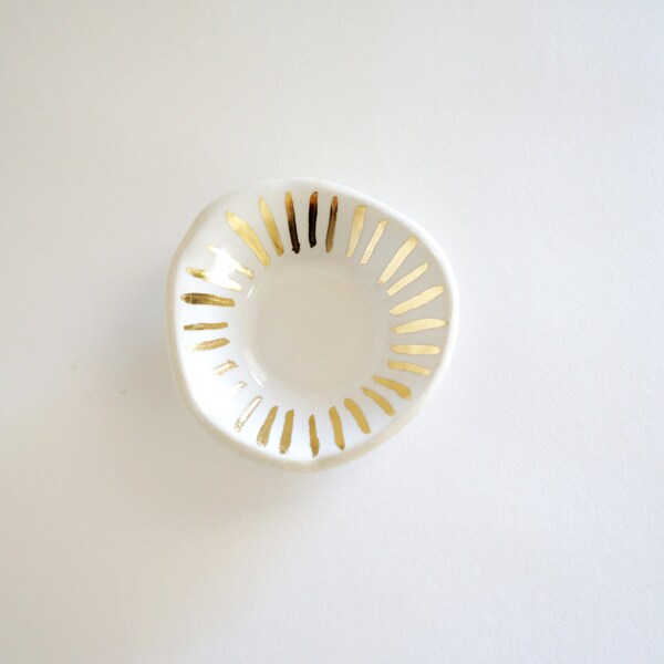 white and gold porcelain ring dish